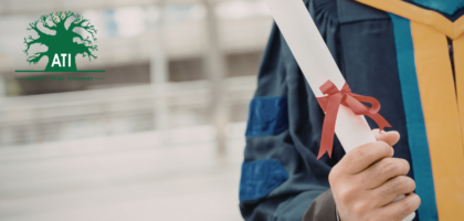 Graduate holding a certificate from a skills development training programme at Artisan Training Institute