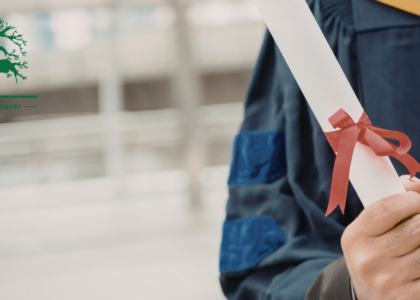 Graduate holding a certificate from a skills development training programme at Artisan Training Institute