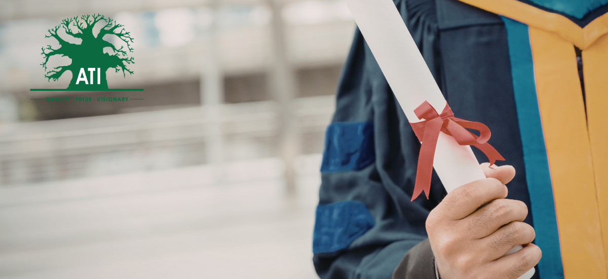 Graduate holding a certificate from a skills development training programme at Artisan Training Institute