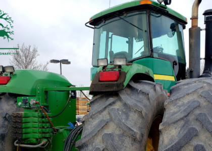 Trained tractor mechanic servicing farm machinery to reduce downtime, an Artisan Training Institute apprenticeship outcome