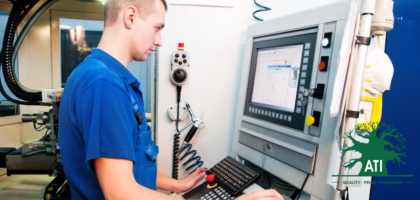 Instrument mechanician apprentice operating a CNC machine control panel, Artisan Training Institute