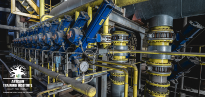 Row of blue hydraulic actuators and yellow pipework on an industrial pump station, representing mechanical fitter training at Artisan Training Institute